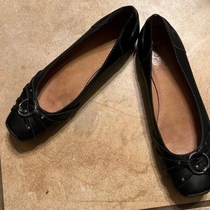 Black leather flats by Frye , 1/2” heels ,all leather sole with brass trim